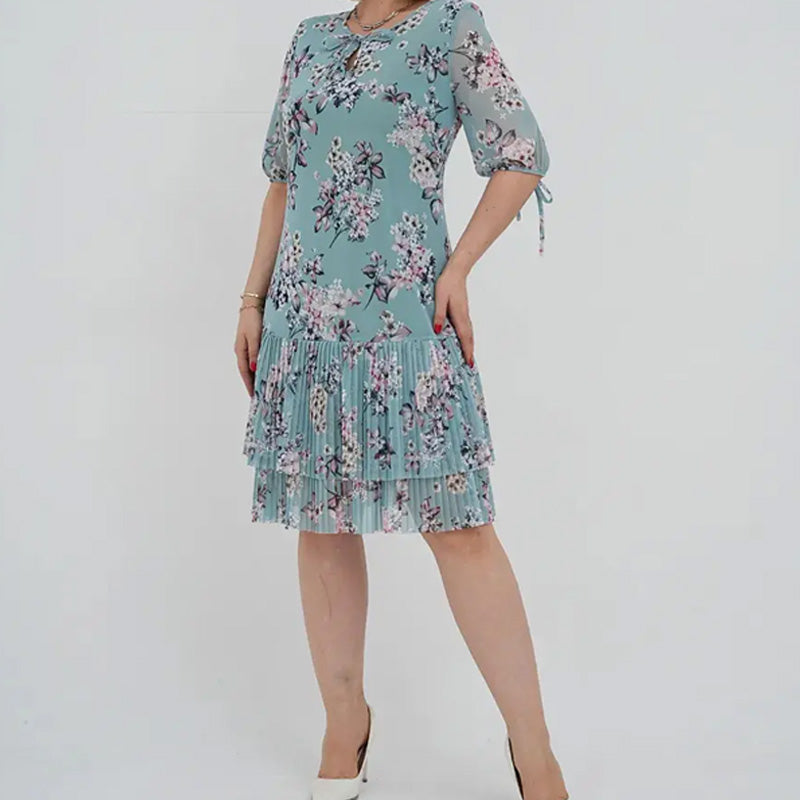 Elegancka damska sukienka plisowana z krótkim rękawem i długą spódnicą